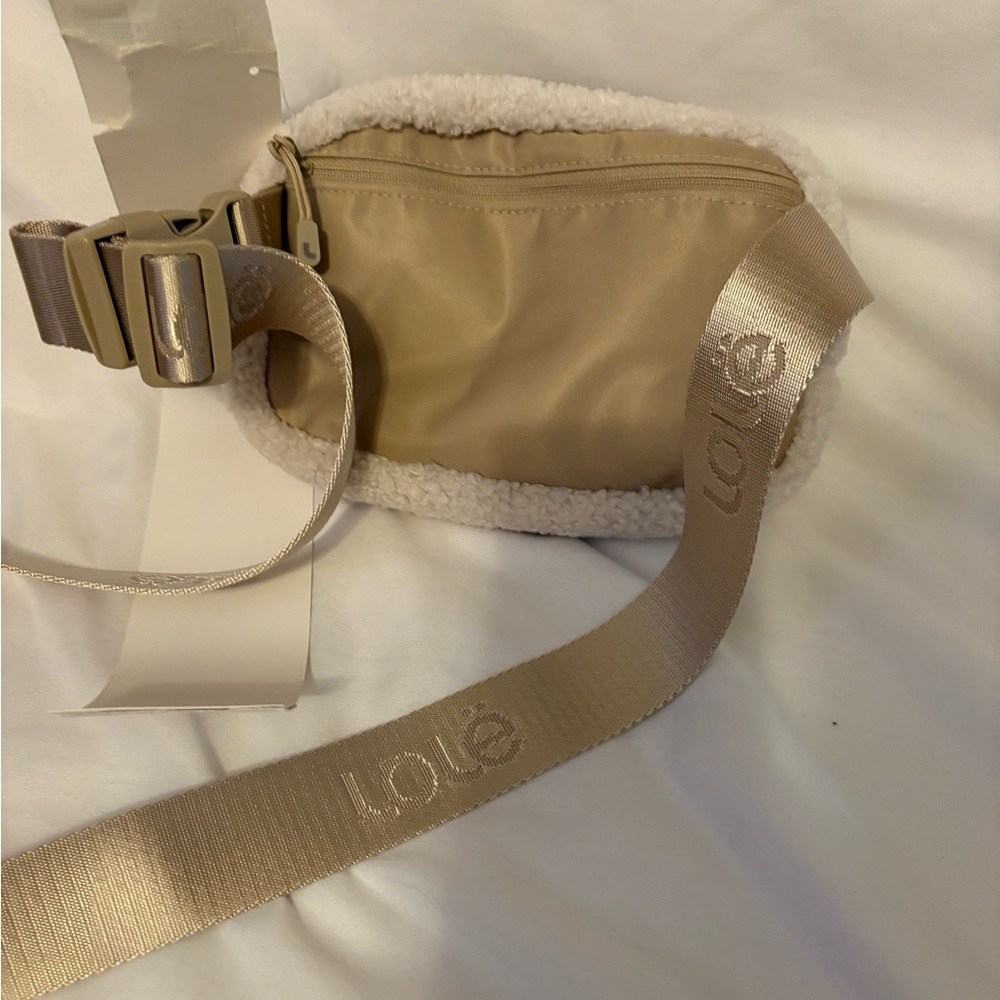 Tan Crossbody Bag with Gold Accents and Minimalist Design